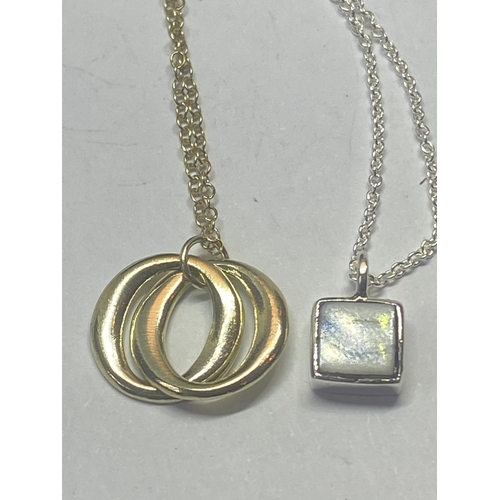 566 - FOUR SILVER NECKLACES WITH PENDANTS TO INCLUDE A GOLD PLATED EXAMPLE