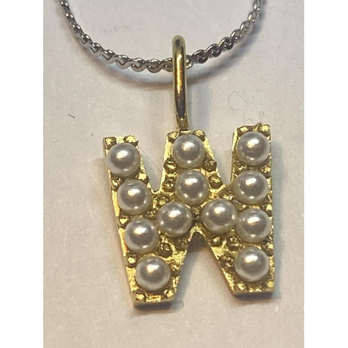 647 - TWO WHITE METAL NECKLACES WITH PEARL STYLE INITIAL PENDANTS Y AND W