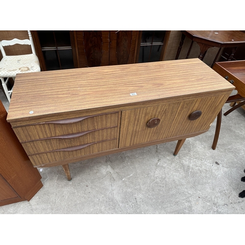 3072 - A RETRO TEAK EFFECT SIDEBOARD ENCLOSING THREE DRAWERS AND TWO CUPBOARDS, 54