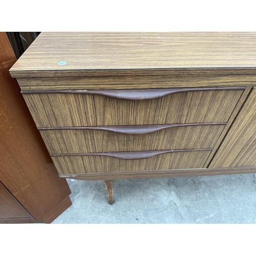 3072 - A RETRO TEAK EFFECT SIDEBOARD ENCLOSING THREE DRAWERS AND TWO CUPBOARDS, 54