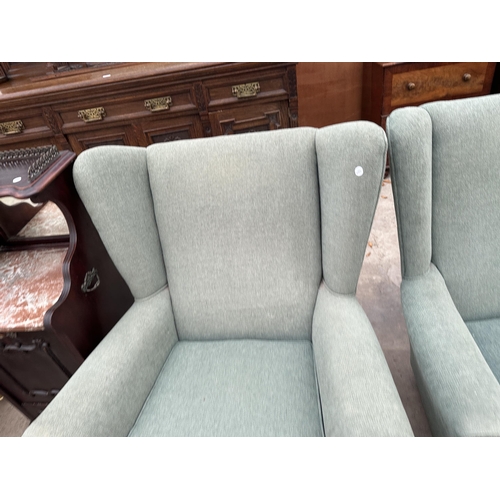 3112 - A PAIR OF WINGED EASY CHAIRS