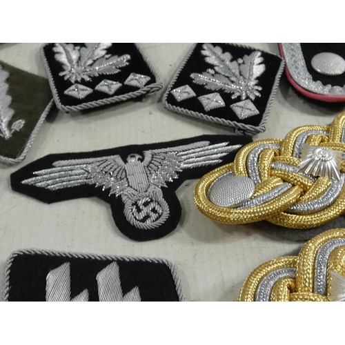 314 - A LARGE COLLECTION OF REENACTOR'S NAZI GERMANY CLOTH BADGES, SHOULDER TABS ETC