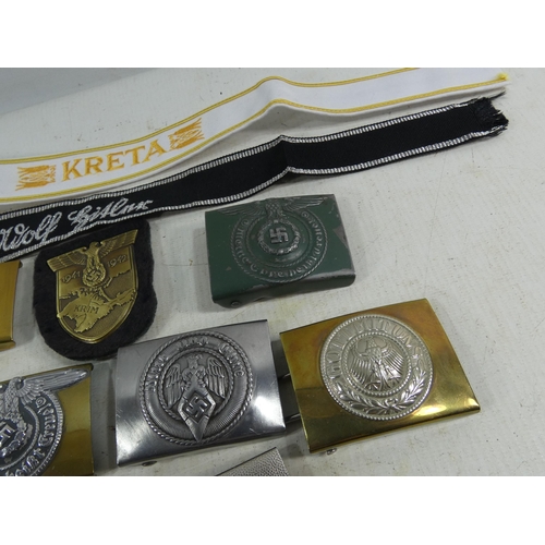 315 - A COLLECTION OF SEVEN REENACTOR'S NAZI GERMANY BELT BUCKLES, CLOTH TALLIES ETC