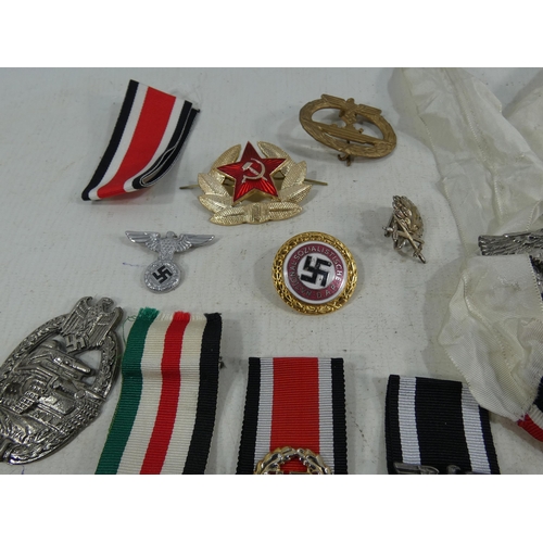 316 - A COLLECTION OF REENACTOR'S NAZI GERMANY BADGES AND MEDALS