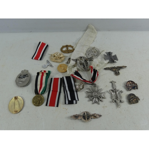 316 - A COLLECTION OF REENACTOR'S NAZI GERMANY BADGES AND MEDALS