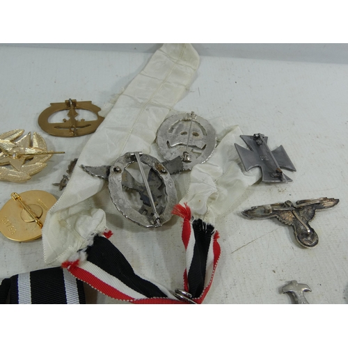 316 - A COLLECTION OF REENACTOR'S NAZI GERMANY BADGES AND MEDALS