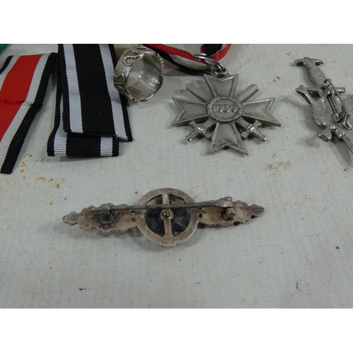 316 - A COLLECTION OF REENACTOR'S NAZI GERMANY BADGES AND MEDALS