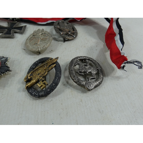 317 - A COLLECTION OF REENACTOR'S NAZI GERMANY MEDALS AND BADGES