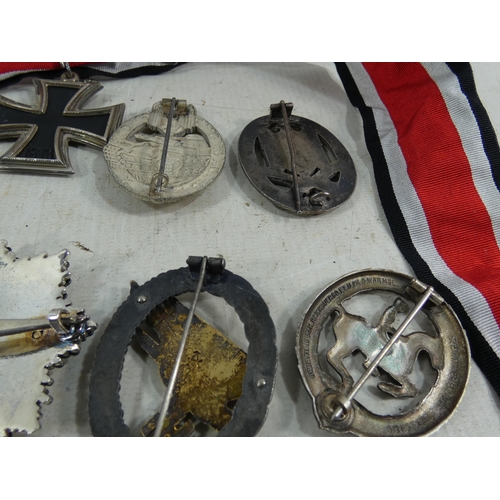 317 - A COLLECTION OF REENACTOR'S NAZI GERMANY MEDALS AND BADGES