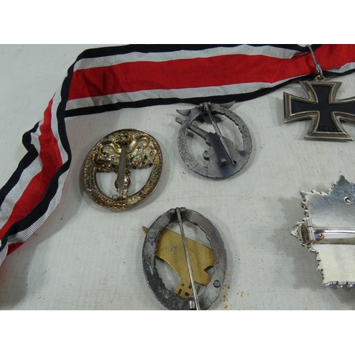 317 - A COLLECTION OF REENACTOR'S NAZI GERMANY MEDALS AND BADGES