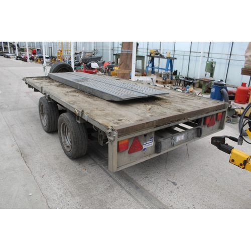 297 - AN IFOR WILLIAMS 10FT x 5.5FT FLATBED TRAILER WITH A PAIR OF LOADING RAMPS +VAT