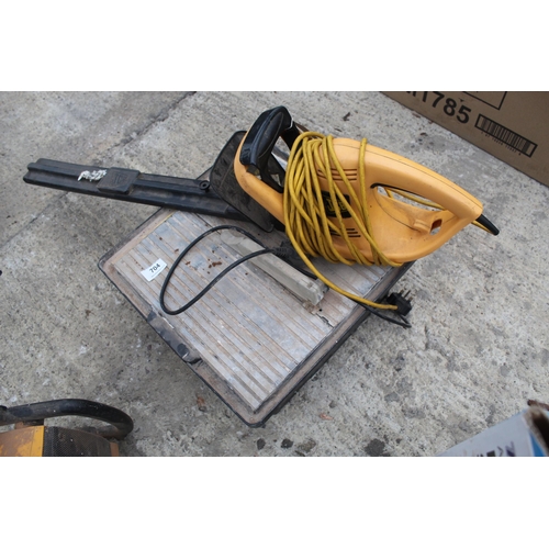 704 - TILE CUTTER AND HEDGE TRIMMER IN WORKING ORDER  NO VAT