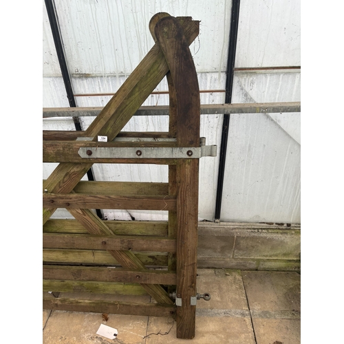 154 - A PAIR OF WOODEN GATES 7' EACH NO VAT