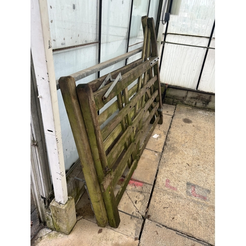 154 - A PAIR OF WOODEN GATES 7' EACH NO VAT