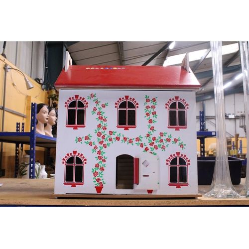 591A - A WOODEN DOLLS HOUSE WITH A QUANTITY OF FURNITURE AND FIGURES