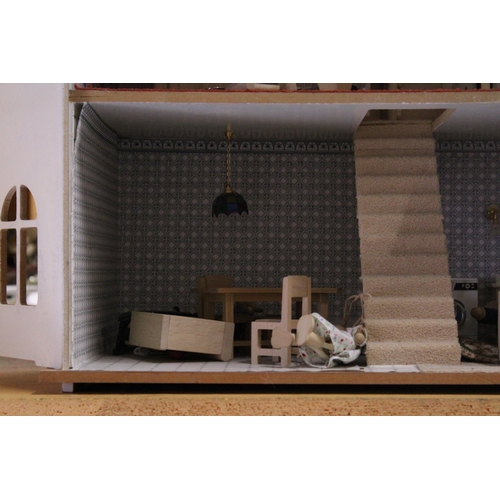 591A - A WOODEN DOLLS HOUSE WITH A QUANTITY OF FURNITURE AND FIGURES