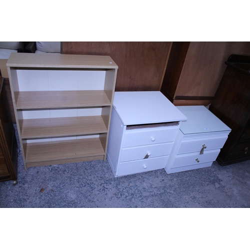 2956 - TWO WHITE BEDROOM CHESTS AND AN OPEN THREE TIER BOOKCASE