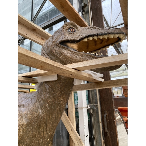 1501 - A LARGE FIBRE GLASS RAPTOR DINOSAUR (H:150CM L:225CM)