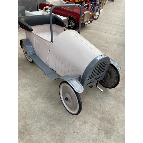 1510 - A VINTAGE PINK PEDAL CAR