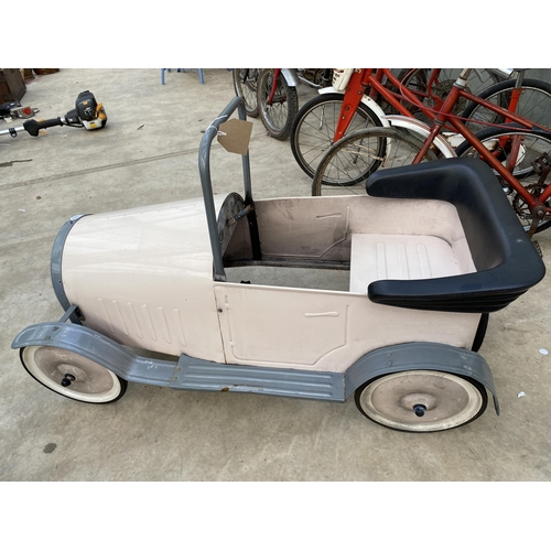 1510 - A VINTAGE PINK PEDAL CAR