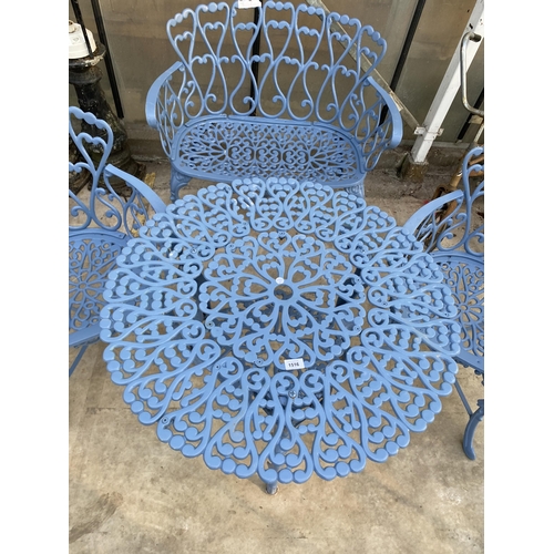 1516 - A DECORATIVE PATIO BISTRO SET COMPRISING OF A ROUND TABLE, A SMALL BENCH AND TWO CARVER CHAIRS