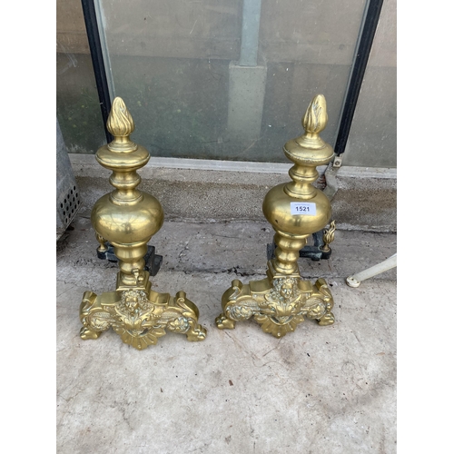 1521 - A PAIR OF LARGE DECORATIVE BRASS FIRE DOGS