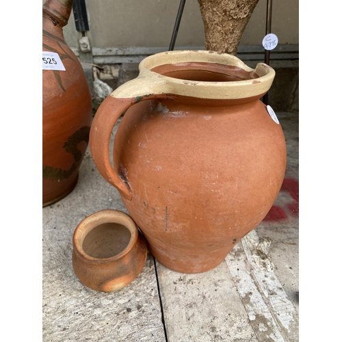 1525 - FOUR VARIOUS TERRACOTTA JUGS AND VESSELS TO INCLUDE AN URN WITH A METAL STAND