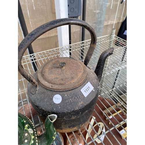 1531 - A METAL BARGE WARE STYLE KETTLE AND A FURTHER CAST IRON KETTLE