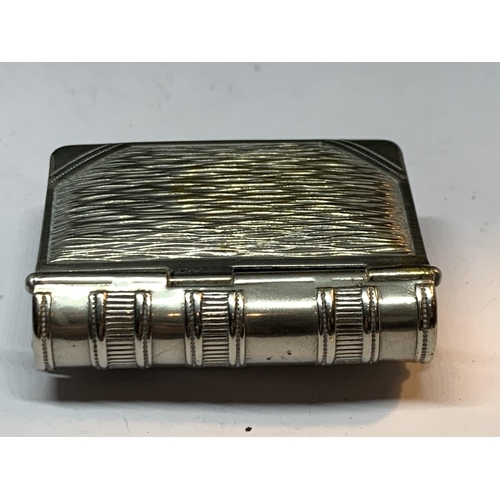 18 - THREE SILVER PLATED ITEMS TO INCLUDE A SOVEREIGN AND VESTA CASE IN THE FORM OF A BOOK, A DECORATIVE ... 