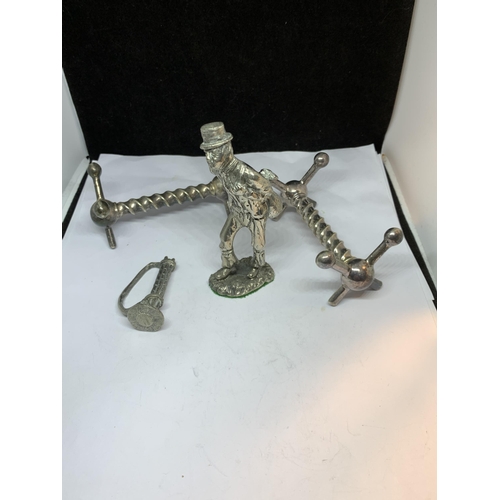 47 - FOUR SILVER PLATED ITEMS TO INCLUDE AN 18TH CENTURY BURGLAR, TWO CUTLERY RESTS