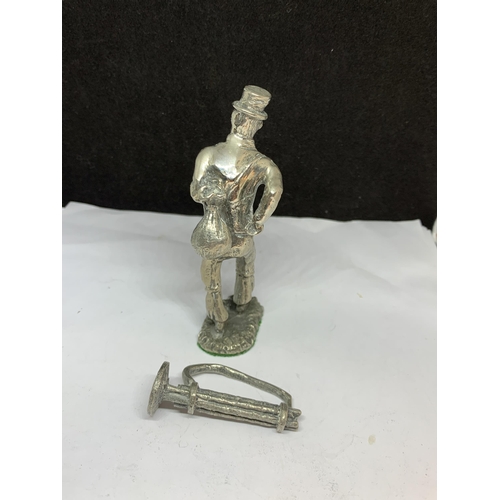 47 - FOUR SILVER PLATED ITEMS TO INCLUDE AN 18TH CENTURY BURGLAR, TWO CUTLERY RESTS