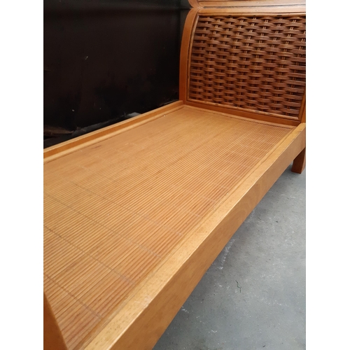 2627 - A HARDWOOD AND RATTAN COFFEE TABLE WITH GLASS TOP, 42