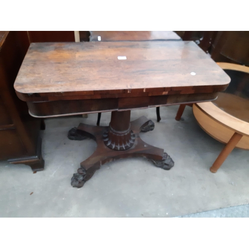 2629 - A VICTORIAN ROSEWOOD FOLD OVER GAMES TABLE ON CLAW FEET, 36