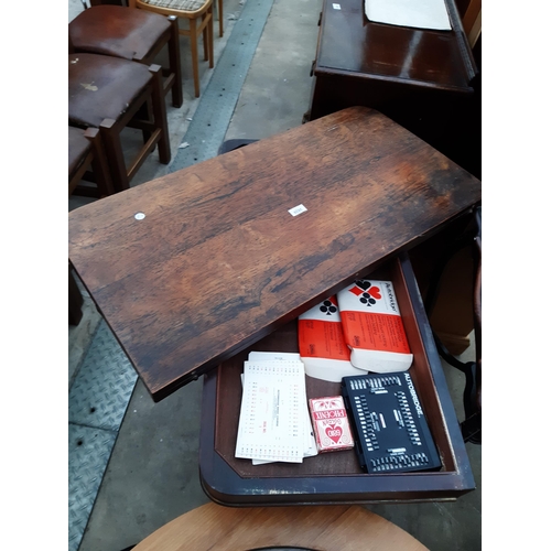 2629 - A VICTORIAN ROSEWOOD FOLD OVER GAMES TABLE ON CLAW FEET, 36