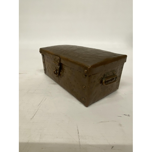 103 - AN ARTS AND CRAFTS HAMMERED COPPER AND RIVETED TRUNK STYLE BOX 16CM LONG