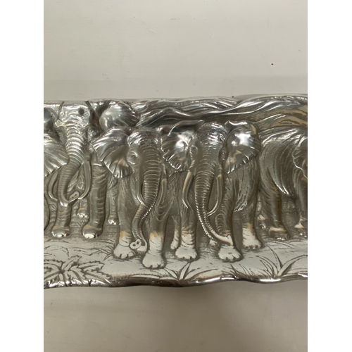 104 - A CAST ALUMINIUM ELEPHANT RELIEF TRAY, MADE IN MEXICO, LENGTH 48CM, WIDTH 15CM, HEIGHT 2CM