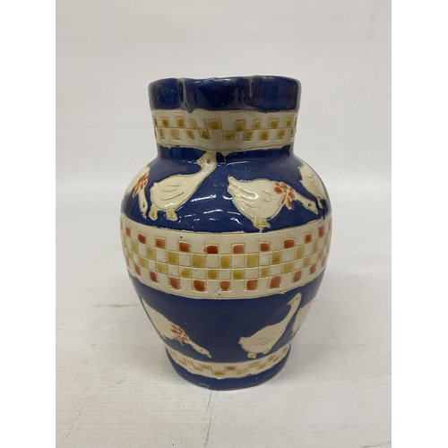 111 - A BLUE CRACLE GLAZE CHINESE LAMP, HEIGHT 32CM PLUS A VIINTAGE JUG WITH GEESE DESIGN