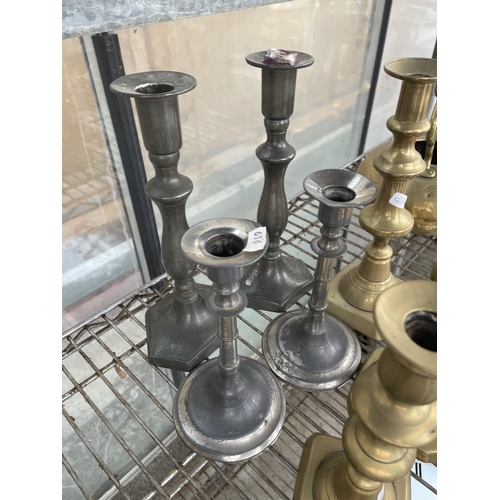 1549 - A LARGE QUANTITY OF BRASS AND SILVER PLATED CANDLE STICKS