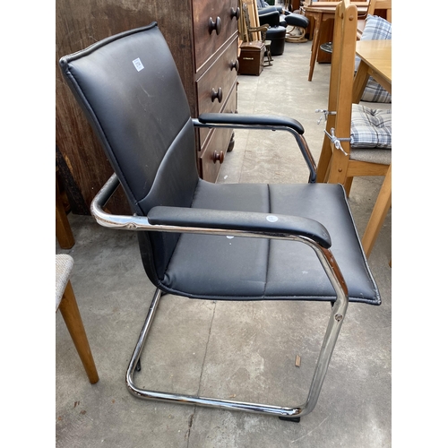 2754 - A BLACK FAUX LEATHER ELBOW CHAIR ON POLISHED CHROME TUBULAR FRAME