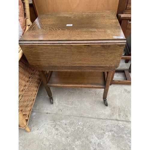 2768 - A MID 20TH CENTURY OAK TWO TIER DROP LEAF TROLLEY