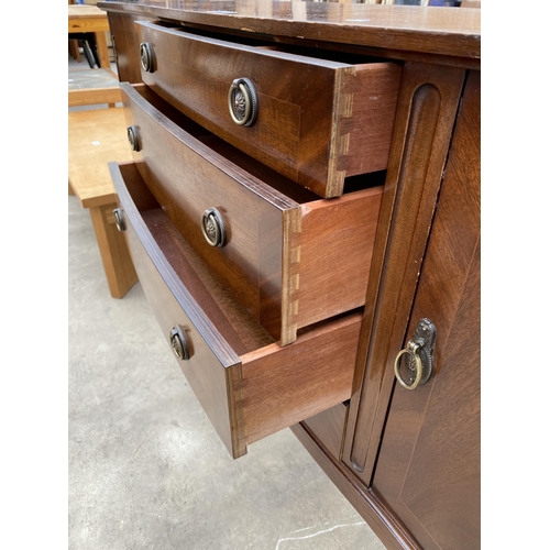 2775 - A REGENCY STYLE MAHOGANY AND CROSSBANDED SERPENTINE FRONT SIDEBOARD, 57