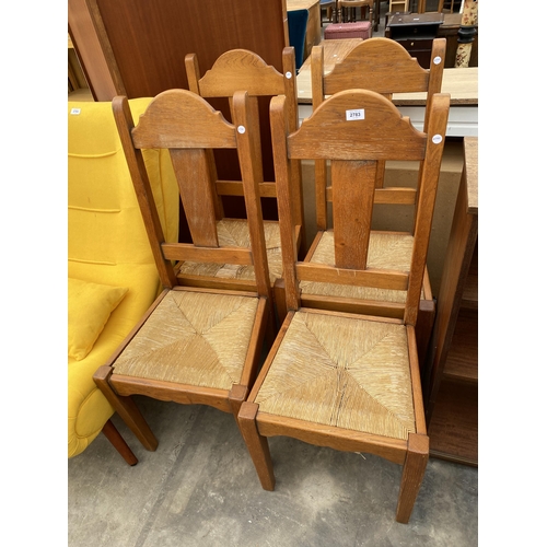 2783 - A SET OF FOUR OAK DINING CHAIRS WITH RUSH SEATS