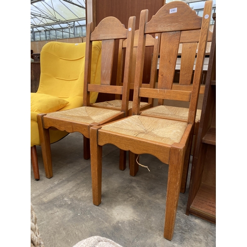 2783 - A SET OF FOUR OAK DINING CHAIRS WITH RUSH SEATS