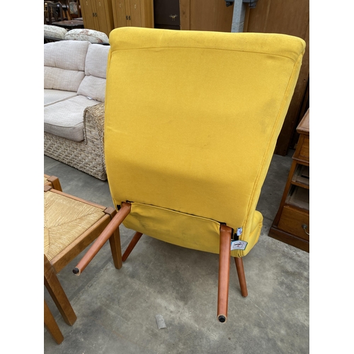 2784 - A HOME AND GARDEN YELLOW CURVED LOUNGE CHAIR ON KICK OUT TAPERING LEGS