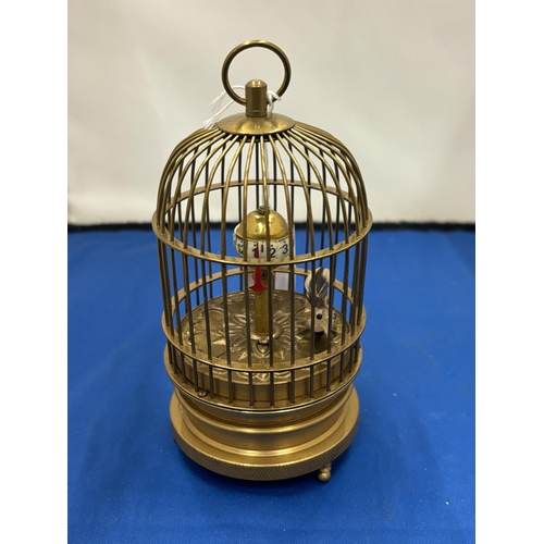 12 - A MECHANICAL BRASS BIRD CAGE CLOCK SEEN WORKING BUT NO WARRANTY