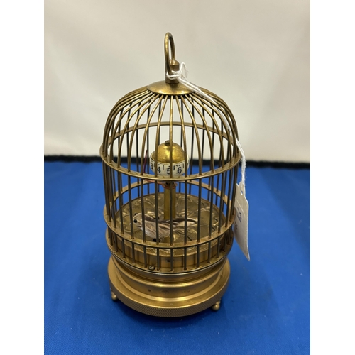 12 - A MECHANICAL BRASS BIRD CAGE CLOCK SEEN WORKING BUT NO WARRANTY