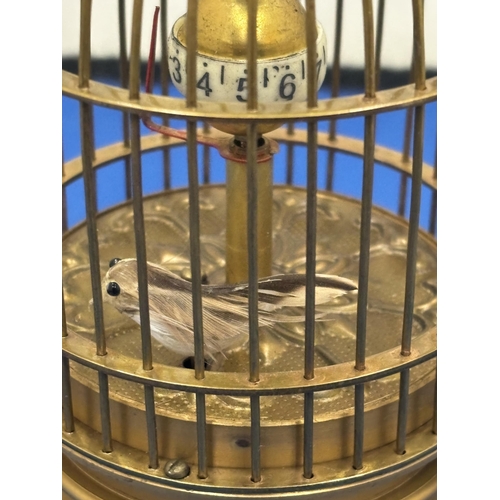 12 - A MECHANICAL BRASS BIRD CAGE CLOCK SEEN WORKING BUT NO WARRANTY