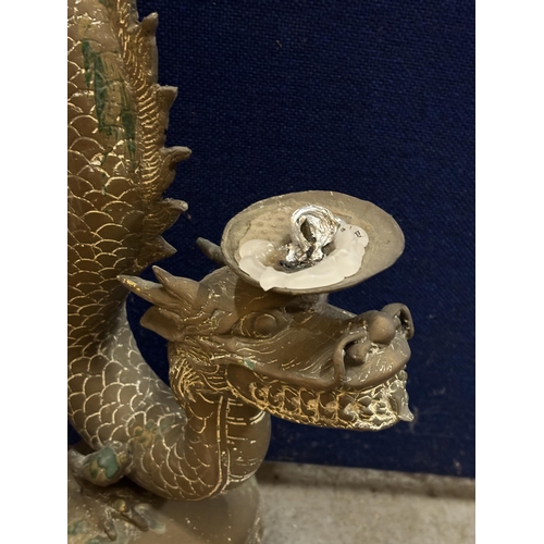 20 - A PAIR OF DECORATIVE BRASS CHINESE DRAGON CANDLE HOLDERS