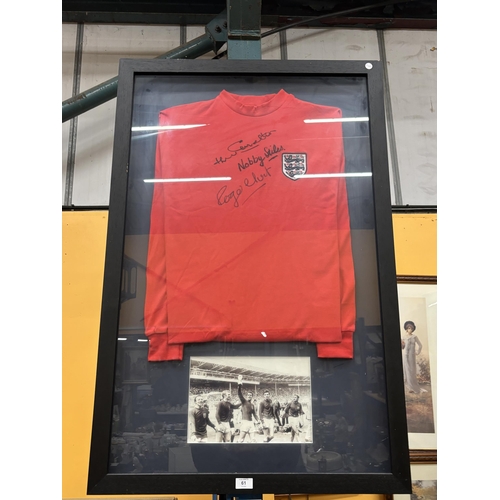 61 - A FRAMED ENGLAND 1966 REPLICA SHIRT SIGNED BY JACKIE CHARLTON, NOBBY STILES AND ROGER HUNT. VENDOR S... 