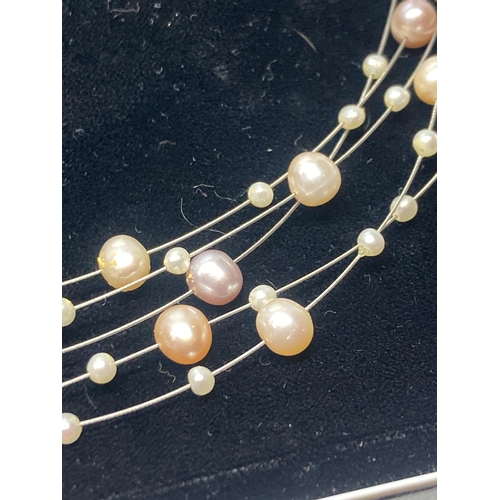 635 - A SILVER, PEARL AND COLOURED PEARL MULTI STRAND NECKLACE IN A PRESENTATION BOX